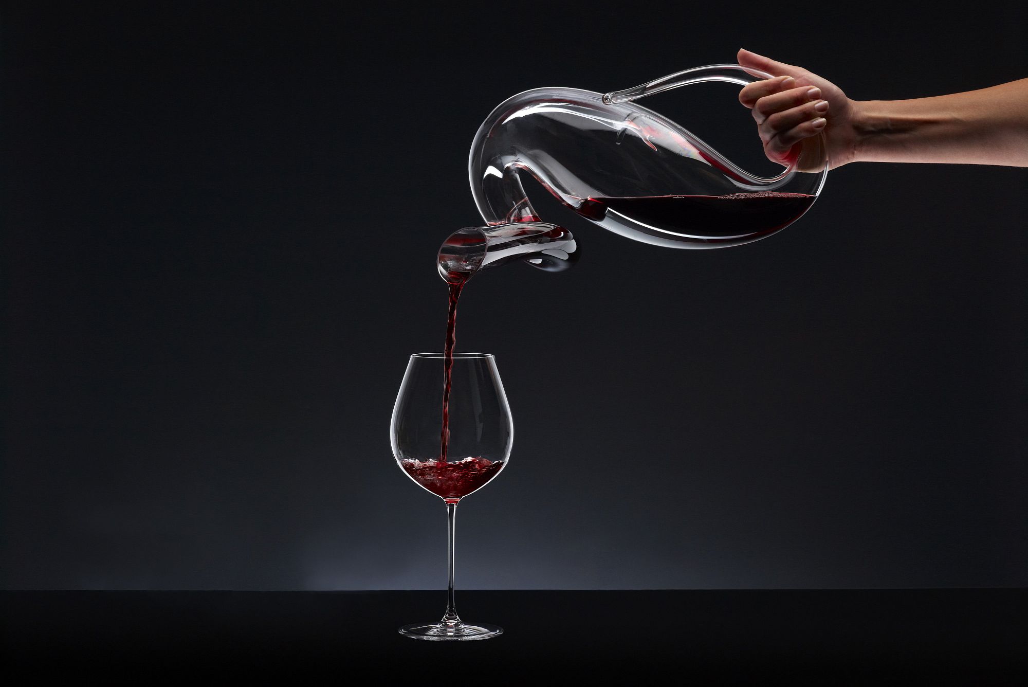 A wine being carefully decanted, from the Blueprint